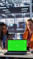 Vertical Team of goal oriented general managers discuss about goals next to copy space, using analytics and global information to work on expansion. Working hard to obtain funds for objectives. Camera B. video