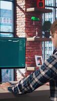 Man listening music while using AI program turning text prompt into videos. Person putting on headphones, interacting with text to artificial intelligence generative model, camera A video
