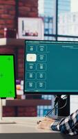 Man looking at tutorial on green screen tablet to learn how to use text to generative models. Man in home office watching guide on mockup device about AI program, camera B video