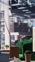 Vertical Modern office space with financial data on a monitor used for meetings, running detailed analytics and graphs. Empty workspace to develop business strategies for success, productivity tools. video
