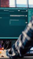 Man at home asking questions to AI LLM chatbot virtual assistant answering user prompts. Person receiving helpful information from artificial intelligence large language model program on PC, camera B video