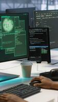 Vertical Team of engineers in server hub trying to protect gear from hacker stealing sensitive information. Data center coworkers struggling to erase virus after seeing security breach notification, camera A video