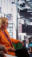 Vertical Diverse group of businesswomen participate in a remote conference call, showcasing leadership and cultural diversity in an inclusive workspace. Setting tasks in a briefing meeting. Camera B. video