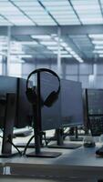 Vertical Close up of tablet in data center workspace used for controlling company network infrastructure. Focus on coding software on device in server room used to ensure optimal system performance video