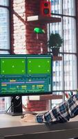 Remotely working videographer doing montage using specialized software application on green screen PC. editor using editing tools on mockup computer to cut movie project footage, camera A video