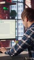 Software engineer at computer coding, creating software using isolated screen tablet. IT specialist in home office working with code editor, building applications using PC and mockup device, camera A video