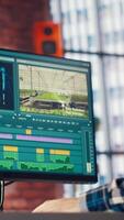 editor analyzing film montage, editing color grading and lighting in creative home office, zoom in shot. Post production studio employee working with raw footage to improve quality, camera B video