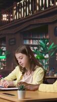 Vertical Teacher assisting scholars with class homework for mentoring session, providing academic instruction and support to help with the curriculum. Tutor lecturer gives private lessons. Camera A. video