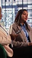 Vertical Dissatisfied business partners feeling frustrated about a project failure, worried about the challenge and negative effects. Businesswomen making a mistake and working under pressure. Camera A. video