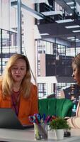 Vertical Corporate leaders demonstrating powerful collaboration and strategic thinking, share insights and big ideas in a briefing meeting. Women strategizing for growth fostering diversity. Camera B. video