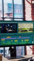 editor selecting key frames to use while doing montage, working from home on computer. Man using mouse to edit movie project footage in apartment office, camera A video