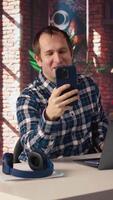 Happy employee at home office desk organizes calendar appointments, doing videocall with coworkers. Worker preparing for corporate event, doing remote videoconference meeting with colleagues, camera A video