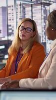 Vertical Multiethnic staff helping their director to overcome a business failure, working together to fix this problem. Businesswomen discussing with the CEO for consolation, organizational risks. Camera B. video