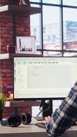 Software developer at computer coding, creating software, implementing algorithms. IT expert in home office working with code editor, building applications, optimizing performance, camera A video