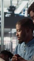 Vertical Business manager sits with a worker to review financial forecasts on pc, leading an analytics evaluation on project development. Achieving organizational goals for growth. Camera A. video