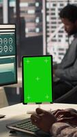 Vertical Business manager at desk looking at mockup screen and solving tasks for company objectives accomplishment. Fighting for performance goals to ensure successful corporate outcomes. Camera A. video