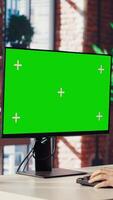 Teleworker in living room home office using chroma key PC to answer emails from business associates. Remote employee typing on isolated screen device keyboard, solving tasks in apartment, camera B video