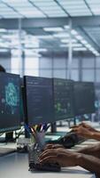 Vertical Manager assisting data center engineer in solving tasks, maintaining company network infrastructure. Team leader in server farm helping worker ensuring optimal system performance video
