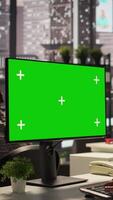 Vertical Businesswoman at office desk looks at green screen on device, studying documents and infographics to support effective decision making and company objectives. Administrative tasks. Camera B. video