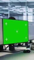 Vertical African american data center admin using mockup PC, maintaining company network infrastructure. Man working in server farm ensuring optimal system performance with green screen computer video