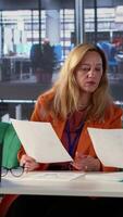Vertical Team of business colleagues study feedback on old projects to improve their work for the future, developing an expansion plan in meeting room. Ambitious powerful women with skill. Camera A. video