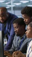 Vertical Coworkers in data center doing brainstorming, implementing AI predictive maintenance systems. Server hub colleagues discussing, using artificial intelligence to identify hardware failures, camera A video