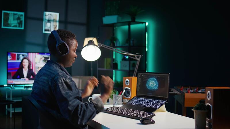 Data scientist using laptop, updating artificial intelligence machine ...