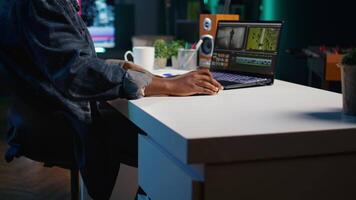 Professional editor analyzing film montage before editing color grading and lighting in creative office. Post production studio employee working with raw footage, improving quality, camera B video