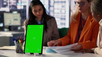 Entrepreneurs team with a success story work next to green screen, using professional tools to meet project deadline and obtain business growth. Leadership skills and professionalism. Camera A. video