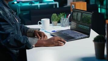 editor selecting key frames to use while doing montage, using specialized software applications. Freelancer using editing tools on computer to cut movie project footage in office, camera A video