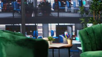Executive workspace features a digital monitor with financial charts and reports, luxurious setup emphasizes data driven insights. Empty office space used for business growth meetings. video