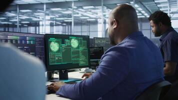 Data scientists receive access granted notification while reconfiguring server hub, optimizing it. Team of IT experts ensures data center operates efficiently, successfully eliminating all errors video
