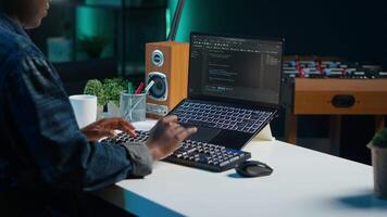 Freelancing admin in home office using laptop to write programming language code. Software technician working from home using notebook device to build application, camera A video