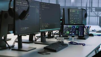 PCs, headphones and tablets in data center employing machine learning technology to maintain company network infrastructure. Electronic devices used in server room to ensure optimal system performance video
