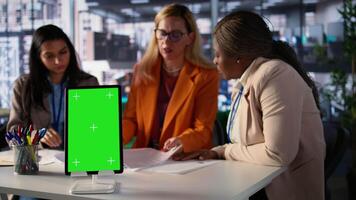 Entrepreneurs team with a success story work next to green screen, using professional tools to meet project deadline and obtain business growth. Leadership skills and professionalism. Camera B. video