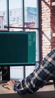 Man solving personal tasks with AI LLM chatbot answering prompts using predictive technology. Person using computer in apartment to interact with large language model program, camera A video