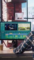 Remotely working videographer doing montage using specialized software applications. editor using editing tools on PC to cut movie project footage in home office, camera A video
