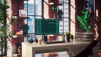 AI LLM chatbot software interface on PC in home office showing virtual assistant answering user prompts. Large language model program on monitor communicating with user through artificial intelligence video