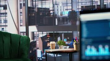 Luxurious office space in a multinational company with a monitor, presenting performance metrics and data analysis on a TV screen. Modern workspace in a corporation used for meetings. video
