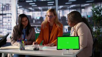 Group of businesswomen sharing insight on a new project next to copy space, collaborating to achieve global enterprise success in a men dominated professional environment. Camera B. video