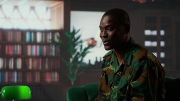Black distraught war veteran crying due to shell shock and combat flashbacks, cure his anxiety after traumatic experiences. Army soldier dealing with a mental disorder during therapy. Camera B. video