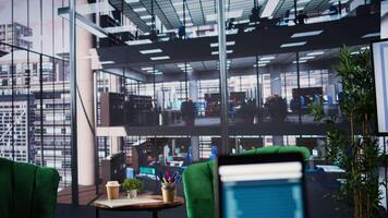 Modern luxurious conference room with a monitor showing data analytics, space used for business staff to discuss company ideas. Empty high end professional office enhances productivity. video