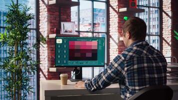 Man in apartment workspace using AI software turning text prompt into photos. Person in brick wall home uses text to image artificial intelligence generative models on computer, camera A video