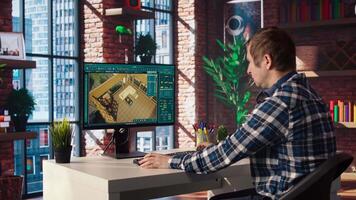 Man doing remote work on computer screen, moving assets in 3D modeling program. Teleworking interior designer using computer aided architectural design software on PC, camera A video