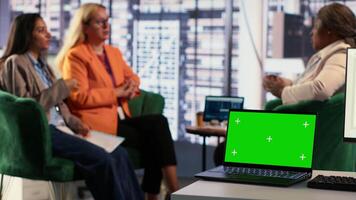 Multiethnic group of women working together next to copy space display, ensuring a successful project in a men dominated business industry. Leaders sharing insight on their plans. Camera A. video