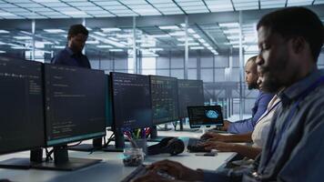Woman putting headphones on in server room, developing disaster recovery plans ensuring minimal downtime. Engineer listening music in data center, using data analytics to monitor performance, camera A video