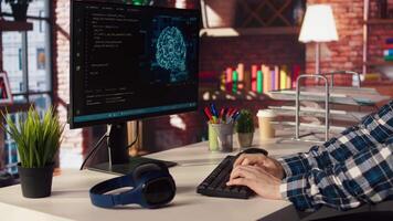 Freelancing computer engineer doing maintenance on artificial intelligence systems, closeup. Remote tech support specialist at working from home, doing checkup on AI systems, camera A video