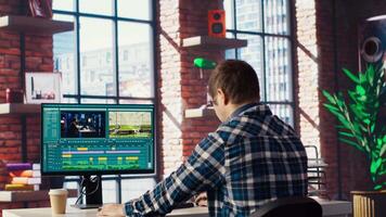 Remotely working videographer doing montage using specialized software applications. editor using editing tools on PC to cut movie project footage in home office, camera B video