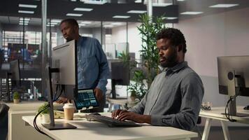 Black coworkers collaborating on investment strategy with data on files, CEO and assistant with extensive expertise to work on decision making. Administrative tasks in the office. Camera B. video