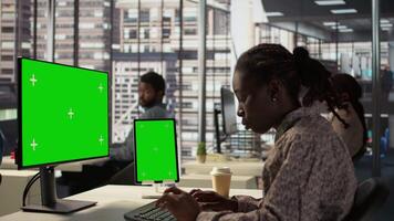 Corporate executive worker focused on strategic planning next to green screen, accomplishing business objectives. Female manager engaged in budget analysis and performance metrics. Camera B. video